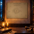 MA-001 The Founding Survey map print pinned above a candlelit scholar's desk with a lantern, books, spyglass and compass